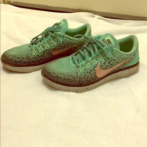 Turquoise Nike’s running shoes